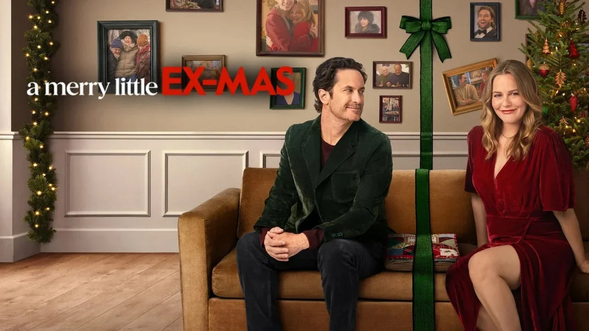Official movie poster for A Merry Little Ex-Mas featuring Oliver Hudson and Alicia Silverstone sitting on a velvet couch inside a holiday frame.