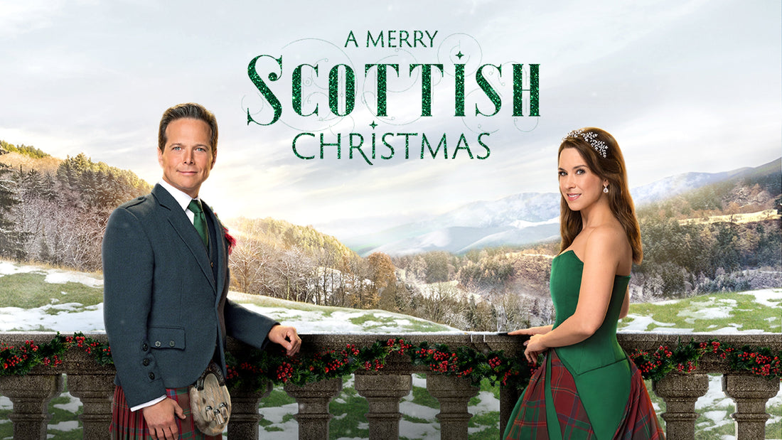 Promotional poster showing Scott Wolf in a kilt suit and Lacey Chabert in a green tartan gown leaning on a snow-dusted stone balustrade decorated with evergreen garland against a snowy Scottish mountain backdrop.