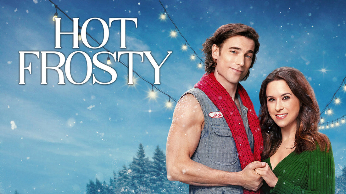 Promotional poster for Hot Frosty showing Jack in a sleeveless denim shirt with a red scarf holding hands with Kathy in a green sweater, set against a snowy blue sky with glowing string lights.
