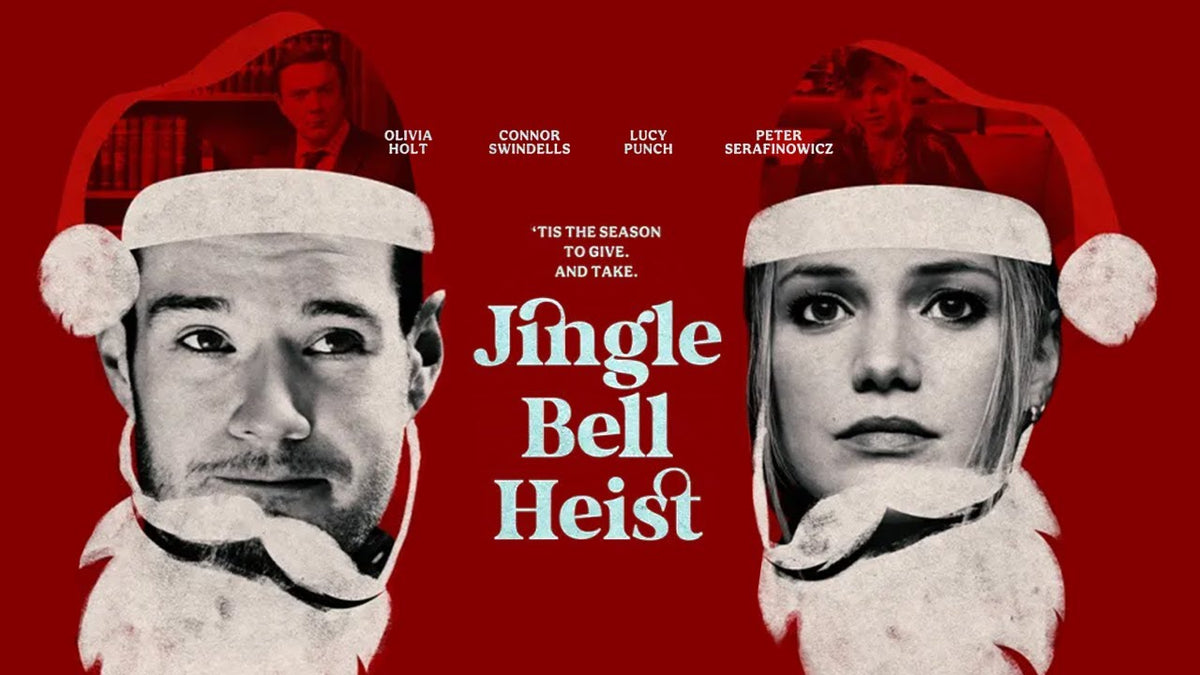 Official poster for Jingle Bell Heist featuring Connor Swindells and Olivia Holt wearing Santa hats, with cast names and title text in front of a red background.