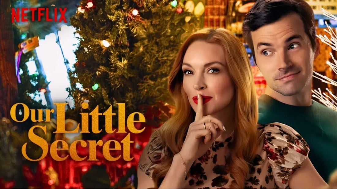 Promotional poster for Netflix's Our Little Secret featuring Lindsay Lohan holding a finger to her red lips in a "shh" gesture next to Ian Harding peaking over her shoulder, set against a festive background with Christmas tree lights.