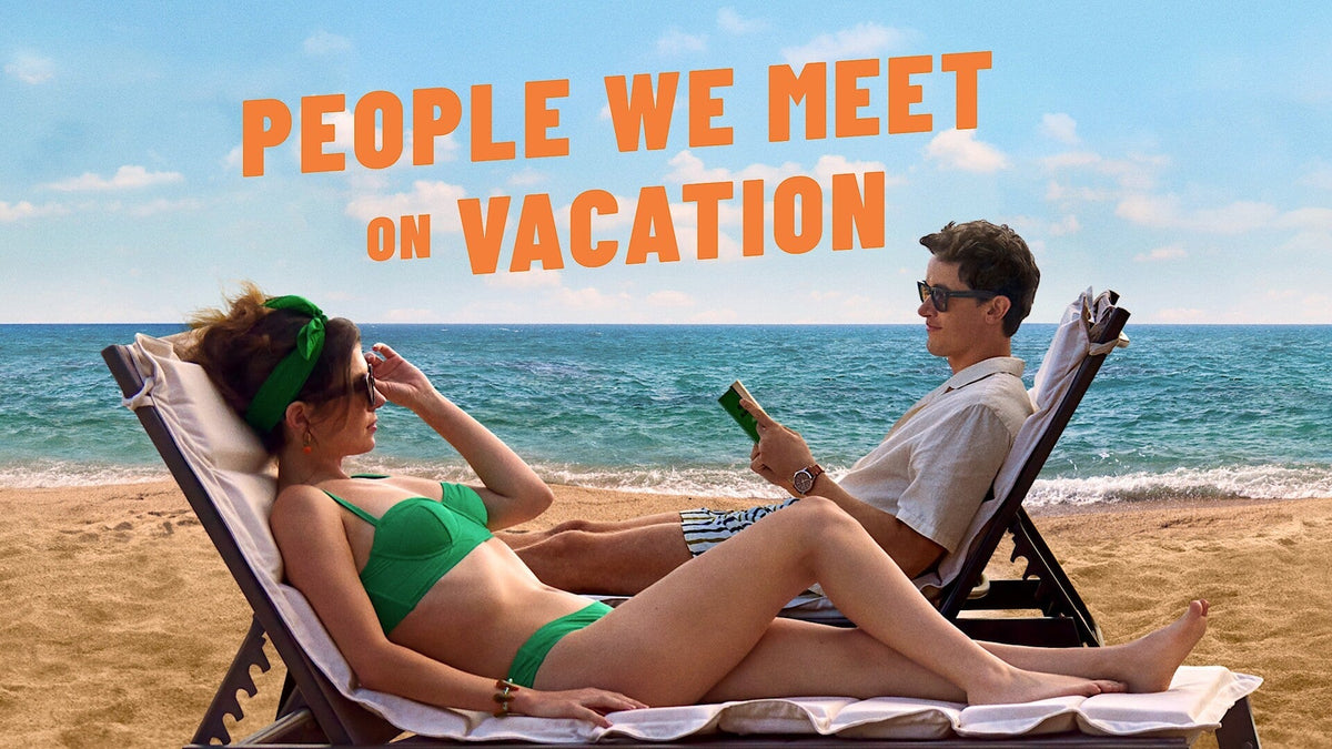 Official poster for People We Meet on Vacation featuring Emily Bader as Poppy and Tom Blyth as Alex lounging in beach chairs by the ocean.